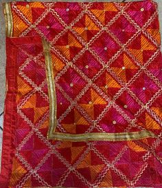 Mothers day gift orange pink colour Phulkari Dupatta for women | Phulkari also called Indian Dupatta | Used as Dupatta Stole  Phulkari is traditional artwork of Embroidery indigenous to Punjab region of India. Punjabi women traditionally created it with hand over many days to gift/wear on occasions. This heritage of Punjab is preserved in our Phulkari Dupatta. Hope you have a glimpse of this rich heritage through our Dupattas.  Our feather-soft threads have the lustre that will add a distinct sparkle to your look. Be it your traditional outfit or a modern ensemble, a phulkari dupatta can never go wrong in adding its appeal to your elegance. These timeless pieces will always stay as your prized possessions.  Light Phulkari Dupatta for Women with Full Hand Work All Over It Premium Multi Colo Indian Dupatta, Orange Pink Color, Phulkari Dupatta, Traditional Outfit, Golden Leaf, Traditional Artwork, Rose Orange, Golden Leaves, Pink Colour