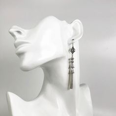 925 Sterling Silver Handmade Artisan Crafted Filigree Dangle Drop Tassel Earrings Material: 925 Solid Sterling Silver, 925 Stamped Earrings Length: 3.30 inches Width: 0.35 inches Finishing: Oxidized and Polished Comes with a gift pouch and box Free Domestic Shipping We hope that you enjoy our exclusive artisan handcrafted jewelry. Elegant Handmade Silver Tassel Earrings, Adjustable Silver Tassel Earrings For Party, Elegant Handmade Long Drop Tassel Earrings, Elegant Long Drop Handmade Tassel Earrings, Elegant Long Drop Tassel Earrings For Gift, Elegant Silver Tassel Earrings For Party, Elegant Long Drop Tassel Earrings, Silver Dangle Tassel Earrings For Pierced Ears, Silver Nickel-free Dangle Tassel Earrings