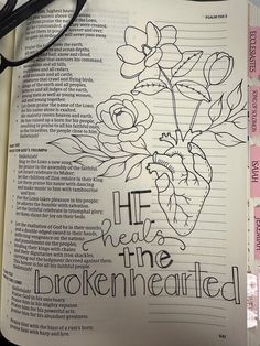 an open bible with flowers and the words he will be the brokenhearted on it