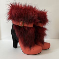 Vintage Red Pearl - MC Chunky Faux Fur High Heel Short Booties Size 38 Made in Turkey Sleek style is yours when you slip into these unique Zeyzani chunky heel boots!  This is what they mean when they say boots with the fur! So fun and so unique. Genuine Suede & Genuine Leather Upper Faux fur details upper Lined with breathe-easy genuine leather Round toe Full length zipper closure with buckle accent ¾" platform, 4" chunky heel wrapped with genuine suede Please view pictures as part of the descri Red High Heel Platform Boots For Winter, Bold High Heel Platform Boots For Winter, Red High Heeled Boots For Winter, Red Round Toe Booties For Winter, Bold Winter Heeled Boots With Round Toe, Red Winter Ankle Booties, Red Ankle Booties For Winter, Red Heeled Boots For Winter, Red High Heel Winter Booties