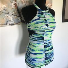 New With Tags Workout Top With Support Bra Built In. Size X-Small And With A Cool And Unique Cut Out On The Sides Of The Top. Comes From A Pet And Smoke Free Home. Summer Athleisure Tops For Night Out, Fitted Athleisure Tank Top For Spring, Spring Athleisure Fitted Tank Top, Fitted Multicolor Tank Top For Gym, Trendy Fitted Sports Tank Top, Green Fitted Athleisure Tank Top, Spring Fitted Sports Tank Top, Fitted Workout Tank Top For Spring, Fitted Spring Sports Tank Top