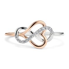 two tone gold and silver ring with an intertwined design on the band, set in white