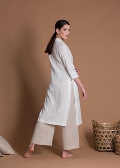 "This women's set includes a linen tunic kurti VICTORY and wide-leg pants BORA with a 10% discount. The tunic and pants are made of linen fabric, which is lightweight, breathable, and soft to the touch.  It has a slim fit on the top and can be paired with the included wide-leg pants for a comfortable and stylish outfit. The pants feature a wide-leg design that offers ample room for movement.  This outfit is custom made so you can choose any size for every piece. Please choose the color for every Spring Linen Straight Kurta Set, White Linen Straight Kurta Set, Elegant White Linen Kurta, Elegant Linen Kurta For Spring, Elegant Linen Straight Kurta Sets, White Linen Straight Kurta, Spring Sets With Side Slits, Summer Linen Straight Kurta Set, Summer Linen Sets With Straight Kurta