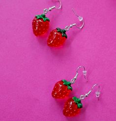 Some cute strawberries to buy for her. Fun Red Resin Earrings, Fun Style Red Resin Earrings, Red Resin Novelty Earrings, Cute Red Earrings With Fruit Design, Cute Red Strawberry Print Earrings, Fun Red Plastic Jewelry, Cute Red Plastic Jewelry, Cute Red Resin Jewelry, Sweet Red Drop Earrings