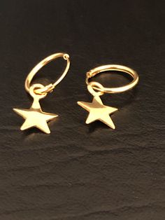 Star 18K Gold Plated Hoop Earrings Sterling Silver Star Earrings, Celestial Earrings Metal: 18K Gold Plated (Vermeil) over 925 Sterling Silver Earrings MEASUREMENT: Width: 12mm Height: 21mm Your Dainty Star hoop Earrings will arrive in a gift box, beautifully wrapped and ready for gifting Please send me a message if you have any questions before or after placing your order. Please visit my storefront to view more of my creations: vonzjewel.etsy.com Thanks a lot for stopping by and supporting my Yellow Gold Star Hoop Earrings, Gold Star-shaped Hoop Earrings, Gold Star-shaped Huggie Earrings, Gold Star-shaped Hoop Earrings With Ear Wire, Gold Hoop Earrings With Star Charm, Gold Star-shaped Single Hoop Earring, Sterling Silver Star Earrings, Beaded Ankle Bracelets, Silver Star Earrings