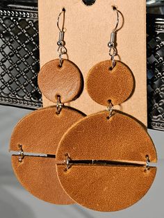 Handmade genuine leather double circle earrings. Modern Brown Leather Earrings, Trendy Handmade Leather Earrings, Trendy Leather Earrings For Everyday, Trendy Brown Leather Jewelry, Trendy Brown Circular Earrings, Trendy Brown Circle Earrings, Brown Leather Round Jewelry, Brown Leather Jewelry, Knot Earrings