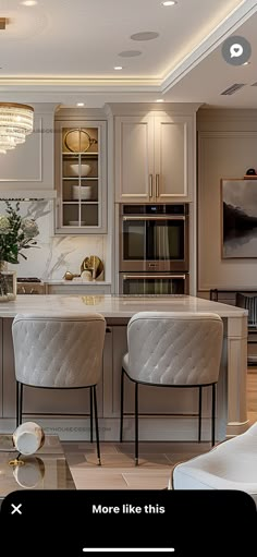 the kitchen is clean and ready to be used for dinner or party time, with two bar stools in front of the island