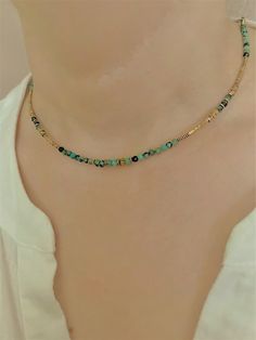 Very delicate and elegant faceted African turquoise necklace choker  with high quality 18k. gold plated  chain and high quality  tiny hematite beads ( don't change color) This necklace is perfect for layering.      Neclace assembled on a very durable jewelry wire.      Necklace length-15.3 in.+2 in.  extension chain     Nickel-free stainless steel lobster clasp.  Excellent gift idea for women. Gold Chain Beaded Necklace, Gold Gemstone Beads Choker Jewelry, Dainty Handmade Gold Turquoise Necklace, Handmade Dainty Gold Turquoise Necklace, Dainty Gold Crystal Necklace With Colorful Beads, Gold Dainty Crystal Necklace With Colorful Beads, Gold Adjustable Minimalist Turquoise Necklace, Minimalist Adjustable Gold Turquoise Necklace, Adjustable Minimalist Gold Necklace