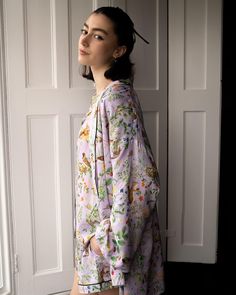 Our shorter length, kimono robe in our feminine Lilac print, from the Meadow Creatures collection is an elegant answer to your nightwear solutions. Thoughtfully fashioned from sustainable fibres; this sumptuous piece of nightwear has been crafted from wood pulp into a premium viscose satin for a lustrous finish that’s dreamy, soft on the skin. A luxury piped trim provides an opulent finish whilst the matching tie belt can double up as a hair accessory as you wind down from the day.
 Key features Spring Silk Kimono For Loungewear, Silk Kimono For Spring Loungewear, Silk Sleepwear For Spring Loungewear, Spring Long Sleeve Silk Sleepwear, Silk Kimono With Floral Print For Loungewear, Silk Long Sleeve Kimono For Daywear, Floral Print Long Sleeve Sleep Kimono, Floral Print Sleepwear With Kimono Sleeves, Spring Silk Sleepwear With Relaxed Fit