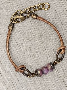 Czech Glass Purple Sapphire Blue Mix beads with antique brass accents on antique brown leather bracelet.  This bracelet has a size fit of approximately 7 inches to 7 1/2 inches. To keep beads, leather and all other components looking their best, avoid contact with water, lotions and perfumes. To access all other items in my shop, just hit the link here: https://www.etsy.com/ca/shop/KootenayLeatherRHS If you like jewelry, check out my other Etsy shop...it's jewelry for your door!  www.etsy.com/ca Adjustable Vintage Bracelets, Vintage Adjustable Jewelry With Leather Strap, Vintage Adjustable Jewelry With Waxed Finish, Adjustable Bohemian Jewelry With Leather Strap, Adjustable Rustic Jewelry With Leather Strap, Adjustable Bohemian Bracelet With Antique Finish, Brown Leather Bracelets With Brass Hardware, Rustic Jewelry With Leather Strap For Gift, Adjustable Vintage Leather Jewelry