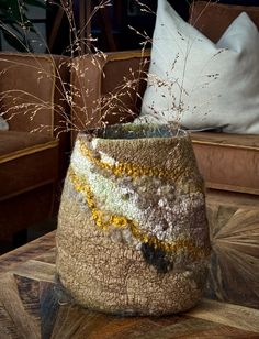 This felt vase in neutral tones will add coziness and uniqueness to your interior. It is made by felting various kinds of wool, and decorated with different fibers and fabrics to give it an unexpected, one of a kind surface textures. It can be used as a vase for dry flowers, or if you would like to put fresh flowers or plants in it, you can insert a waterproof pot. This vase can be a wonderful gift for Christmas, Birthday or Mother's Day. If you have small children, then this is the perfect vase as it will not break. Measurements:  height 9 inches (23 cm) width 8 inches (21 cm). depth 4 inches (10 см) Slight variations in colors from the display picture may occur. Washing and care recommendations:  🌿 wash by hand in warm water 🌿 use detergent for wool 🌿 do not bleach 🌿 do not tumble dr Felted Bowl, Felt Home Decor, Felted Bowls, Felting Art, Fibre And Fabric, Dry Flowers, Display Picture, Surface Textures, Felt Art