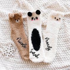 Cute Panda Bear Socks are a fun personalized gift idea for women, friends, & family this holiday season. Get them for your best friends to match at a sleepover or for Christmas morning with the family. Pair them with our comfy sleep shirts, robes, or PJs for a complete gift idea. These fuzzy crew-length socks have adorable bear faces, and are personalized with custom names in black vinyl. Choose from a brown bear, white bear, and a black & white panda bear. DETAILS Listing is for 1 Pair of Fuzzy Bear Socks with Custom Name. NO RETURNS OR EXCHANGES ON SOCKS/CLOTHING ITEMS. Style: Fuzzy Bear Crew Socks (text is printed in black vinyl) Size: Fits shoe sizes 5-9. NO RETURNS OR EXCHANGES ON SOCKS/CLOTHING ITEMS. CARE INSTRUCTIONS:  Wash inside out, gentle cycle, cold water, tumble dry low. More Cozy White Socks As A Gift, Fun White Socks As Gift, Fun White Socks As A Gift, Cozy White Socks As Gift, Cute Super Soft Socks For Stocking Stuffers, Novelty White Socks For Stocking Stuffers, Bridesmaid Fuzzy Socks, Super Soft Playful Socks For Gift, Playful Super Soft Socks For Gifts