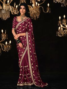 Add the breezy vibrancy of the season to your wardrobe with this captivating purple tissue silk saree. Its rich color, luxurious fabric, and exquisite embellishments make it an ideal choice for any special occasion. Made from high-quality tissue silk material, this saree features intricate sequin work, embroidery work, and tassels on the pallu, adding a luxurious and festive touch to your outfit. The saree comes with a matching color silk material blouse with thread embroidery work, complet Festive Purple Silk Pre-draped Saree, Purple Pre-draped Saree For Wedding And Eid, Purple Pre-draped Saree With Cutdana For Reception, Purple Anarkali Pre-draped Saree For Reception, Purple Pre-draped Saree With Dori Work, Unstitched Purple Pre-draped Saree With Dori Work, Embroidered Purple Pre-draped Saree For Navratri, Festive Purple Pre-draped Saree For Wedding, Purple Chanderi Pre-draped Saree For Wedding