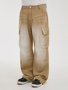 It is a wide fit denim pant designed for unisex. The pant has features of parachute pant and cargo pockets, which make the pant have trendy silhouette. The pant is finished with the brand’s own metal buttons, rivet, and leather label.- Wide fit- Side pockets- Cargo pockets- Back pockets with letter embroidery Khaki Straight Cargo Jeans For Streetwear, Baggy Utility Parachute Pants With Straight Leg, Baggy Straight Leg Utility Parachute Pants, Utility Baggy Straight Leg Parachute Pants, Urban Baggy Cargo Pants With Five Pockets, Baggy Cargo Jeans With Straight Leg, Khaki Cargo Style Jeans For Streetwear, Baggy Wide-leg Cargo Jeans, Baggy Wide-leg Cargo Jeans With Side Pockets