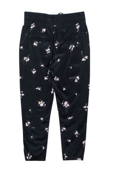 Embrace both comfort and style with A.L.C.'s "Aster" silk pants. Crafted from luxe silk, these soft pants feature a dainty light pink floral print, contrasted by their solid black drawstring waistband for a cozy-cute look. A loosely tailored leg achieves the perfect blend of casual and elegant, making these silky pants a versatile must-have. Size 8 100% Silk Slip-on Elastic waistband w/ drawstring Loosely tapered leg Waist 31.5" Inseam 27.5" Length 40.5" Silky Pants, Soft Pants, Buy Shoes Online, Black Floral Print, Pink Floral Print, Silk Pants, Silk Slip, Luxury Shop, Drawstring Waistband