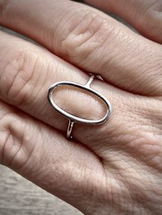 All rings from our geometric collection are solid 925 sterling silver. The geometric design is open and curved allowing the ring to fit comfortably over the natural shape of your finger. Base metal wire thickness is 1.5 mm for a lightweight, modern look. A percentage of my profit will be donated to the Coalition Against Trafficking in Women (CATW) - The world's first organization to fight human trafficking internationally. Care instructions: All pieces in my shop are unique and fragile, they are Modern Nickel Free Stackable Rings, Simple Oval Silver Jewelry, Sterling Silver Oval Stackable Rings, Minimalist Sterling Silver Oblong Jewelry, Modern Oval Midi Rings As Gift, Modern Oval Midi Rings For Gift, Minimalist Oval Sterling Silver Stackable Rings, Simple Oval Sterling Silver Rings, Modern Oval Rings With Simple Design