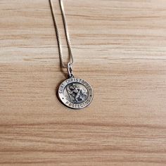 This vintage sterling silver Saint Christopher necklace is a piece worn for protection.  Sterling silver is hypoallergenic and safe for those with sensitive skin. DIMENSIONS:  Chain length: 22.0 inches  Pendant dimensions: 15.2 millimeters x 15.2 millimeters Weight: 3.7 grams MAKER'S INFORMATION:  Maker's mark: Q.G.I. Made in: Italy  Please note that vintage jewelry is pre-loved and might have minor imperfections as seen in the listing images. Silver Minimalist Medallion Charm Necklace, Spiritual Sterling Silver Charm Necklace, Spiritual Sterling Silver Tarnish-resistant Charm Necklaces, Minimalist Silver Medallion Charm Necklaces, Dainty Silver Tarnish-resistant Necklace, Vintage Silver Medallion Charm Necklace, Tarnish Resistant Sterling Silver Necklace, Vintage Sterling Silver Pendant Charm Necklace, Vintage Sterling Silver Pendant Charm Necklaces