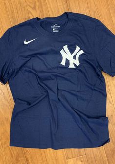 Nike New York Yankees Navy Blue Wordmark Short Sleeve T Shirt - 17320701 Yankees T Shirt, Philadelphia Sports, Cute Shirt Designs, Blue Tee, Nike Tees, Short Sleeve T Shirt, New York Yankees, Puma Jacket, Philadelphia