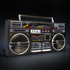 an old fashioned boombox with speakers on it's front and back sides, in the dark