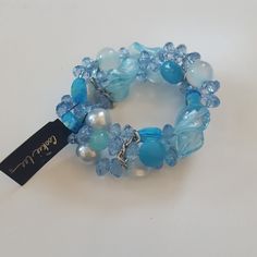 Blue Glass Bead Bracelet Blue Crystal Bracelet With Large Adjustable Beads, Adjustable Blue Crystal Bracelet With Large Beads, Blue Wrap Bracelet With Colorful Beads, Trendy Adjustable Blue Crystal Bracelet, Trendy Blue Glass Jewelry, Trendy Blue Beaded Bracelets For Party, Blue Beaded Crystal Bracelet For The Beach, Blue Beaded Stretch Bracelet For Party, Trendy Blue Bracelets With Faceted Beads