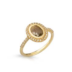 a yellow gold ring with an oval shaped brown diamond