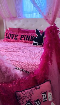 a bed with pink and black decor in a girls'bedroom, decorated for valentine's day