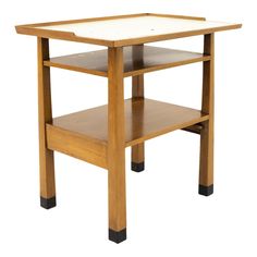 a small wooden table with one shelf on the bottom and two shelves below it that are both open