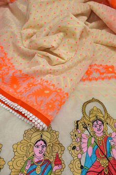 Now get ready with our latest designer jamdani collection with a pallu that comes with a machine-embroidered Durga family with lace work on the border. With all-over self-weaving work, this is a must-buy this puja season. Color: A shade of offwhite and orange color Technique: Comes with lace border and machine embroidered Durga family on the pallu Fabric: Cotton NOTE: Comes with a kalka (paisley) embroidered blouse piece White Cotton Silk Sets With Zari Work, Multicolor Chikankari Embroidery Blouse With Traditional Drape, Multicolor Chikankari Embroidery Blouse For Navratri, Traditional Multicolor Blouse Piece With Chikankari Embroidery, White Semi-stitched Dupatta For Festive Occasion, Off White Chanderi Dupatta For Diwali, Festive White Chanderi Dupatta, Cotton Silk Embroidered Fabric For Navratri, Multicolor Chikankari Embroidery Saree For Navratri