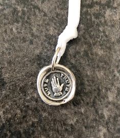 "Wax Seal Pendant/ TRUTH & LOVE in .999 fine silver. This measures just less than 1/2\". Each seal is hand crafted of fine silver (.999) Sterling silver is (.925). Each one is unique as the process is done by hand and not a press. The one you order will look as close to the picture as possible but no two are exactly alike. This is a process of many steps involving forming, drying, firing, hand polishing, and adding the final patina. If you want the silver to be shiny, I can leave off the ant Wax Seal Pendant, Black Sails, Love Charms, Dec 30, Wax Seal, Wax Seals, Silver Stars, Fine Silver, Silver Fashion