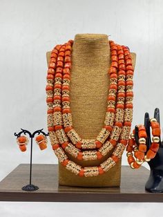 Handcrafted African Coral Beads Necklace - Unique Ethnic Jewelry for a Statement Look Materials: 1. Natural/Original African Coral bead 2. Gold color accessories  3. This listing contains 3 layers of necklace, 2 bracelets and a set of earrings. Length of Necklace: 16 - 20inches Colour of Accessories: Gold   Description: 🌍 African Elegance: Immerse yourself in the rich cultural tapestry of Africa with this exquisite necklace. Each vibrant coral bead tells a story of tradition, craftsmanship, and Bohemian Colorful Beads For Wedding, Bohemian Orange Necklace For Wedding, Traditional Round Beads Jewelry For Ceremonies, Traditional Jewelry With Round Beads For Ceremonies, Traditional Orange Jewelry As A Gift, Traditional Round Beaded Jewelry For Ceremonies, Traditional Orange Jewelry For Gift, Traditional Jewelry For Ceremonies With Round Beads, Colorful Round Beads Jewelry For Traditional Ceremonies