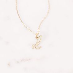 Understated and chic, the Nella Mini Initial Pendant lets you wear your initial or the initial of someone you love with a lowercase letter charm that can be worn on its own or layered with other pieces. Available in sterling silver, 18k gold plated or 18k rose gold plated silver Size: 1/4 to 1/2" (varies by letter) 16" cable chain with 2" extender Spring ring closure Made in the USA This is a lowercase only font, uppercase letters entered will be produced as lowercase This item is FINAL SALE and Everyday Yellow Gold Initial Necklace With Custom Name, Minimalist Rose Gold Jewelry With Initials, Everyday White Gold Charm Necklaces With Initial Pendant, Tan Initial Pendant Charm Necklaces, Dainty 14k Gold Initial Necklace With Charms, Dainty Yellow Gold Monogram Charm Necklace, Dainty White Gold Initial Necklace For Everyday, Everyday Dainty White Gold Initial Necklace, Minimalist Tan Jewelry With Initials