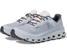 the on cloud running shoe is light grey and black