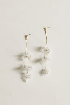 Adina Strand Earrings by A.B. ELLIE Bridal Accessories — A.B. ELLIE Delicate Bridal Earrings For Party, Delicate Chandelier Earrings For Party, Delicate Dangle Bridal Earrings For Evening, Delicate Flower Bridal Earrings For Party, Clear Dangle Earrings For Wedding, Delicate White Chandelier Earrings For Formal Occasions, White Flower Earrings For Celebration, Elegant Clear Flower Shaped Earrings, Delicate White Earrings For Evening