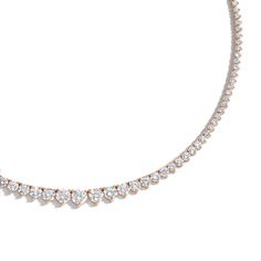 Designed with comfort in mind, the 18 Carat Graduated Tennis Necklace is handmade to be fluid, not rigid, allowing it movement for comfortable wear. It features prong-set brilliant round diamonds ascending in size as it reaches the center of the necklace. Classic Rose Gold Tennis Necklace For Formal Occasions, Formal Rose Gold Tennis Necklace With Diamond Cut, Formal Rose Gold Diamond Cut Tennis Necklace, Formal Fine Jewelry Rose Gold Tennis Necklace, Elegant Rose Gold Round Tennis Necklace, Elegant Rose Gold Tennis Necklace, Rose Gold Round Cut Diamond Necklace For Formal Occasions, Rose Gold Diamond Tennis Necklace For Formal Occasions, Rose Gold Round Cut Diamond Necklace With Prong Setting