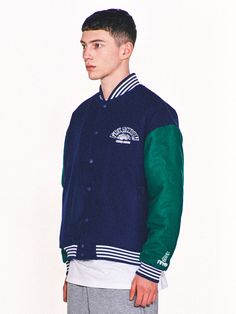 Editor's Notes Featuring various embroidered logo graphics, this casual varsity jacket is made from wool-blend with lightly padded lining for warmth. It's constructed with classic color-blocking body and sleeves with sporty striped ribbed edges.- Snap button fastenings- Two front welt pockets- Logo embroidery on the chest, sleeve and back- Logo labels on the hem and back- Striped ribbed edges- Drop shoulder- Relaxed fitMeasurements (in.) 2 / 3- Total Length: 26.0 in. / 27.2 in. - Shoulder: 22.8 in. / 24.4 in.- Chest: 25.2 in. / 26.8 in.- Sleeve Length: 22.8 in. / 23.6 in.Model info: 5' 11.7, 132.3 lbs / Fitting size 3Composition & Care- Shell: 50% Acrylic, 50% Wool- Lining: 100% Polyester- Filling: 100% Polyester- Dry clean only- Refer to the care labelDesigner- by FREAKISH BUILDING Varsity Style Long Sleeve Outerwear With Contrast Color, Sporty Varsity Jacket With Letter Patch, Sporty Long Sleeve Varsity Jacket With Letter Patch, Casual Outerwear With Contrast Color For College, Casual Contrast Color Outerwear For College, Casual College Outerwear With Contrast Color, Varsity Jacket With Letter Patch And Long Sleeves, Varsity Jacket With Letter Patch, Winter Crew Neck Outerwear With Embroidered Logo