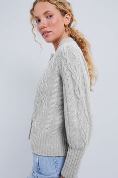 Our best-selling cardigan, updated in luxe cashmereChunky, cozy and always chic- the Gray Cashmere Colette Cardigan takes the very best elements from the classic style and updates it with exaggerated bishop sleeves, gold buttons, and a slightly cropped but not too short length that makes it perfect for layering over dresses or styling solo with high waisted pants. Dressed up or down, in the office or out to dinner, the possibilities are endless with this transitional piece.Our Favorite Details: Gray Cashmere, Texture Material, Kids Sale, The Gray, Too Short, Gold Buttons, High Waisted Pants, Cable Knit, The Office