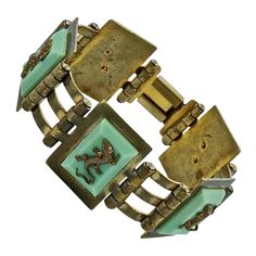 Fabulous Jean Painlevé French Art Deco gold plated link bracelet, with mint green Bakelite, and featuring five salamanders. Measuring length 17.7cm / 6.9 inches by width 2.4cm / .9 inch. The bracelet has wear to the gold plating and scratching. The salamanders are in good condition, one has a twisted tail. This is a beautiful Painlevé salamander bracelet from the Art Deco era. Circa 1930s. A rare find. Measuring Length, Art Deco Gold, Salamanders, Liquid Silver, French Art Deco, Art Deco Era, Belle Epoque, French Art, Link Bracelets