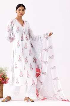 Ivory A-Line kurta with all over purple floral block print, crochet lace work details and V neck. Paired with pant with polka dot print and mulmul dupatta with crochet lace border.
Components: 3
Pattern: Printed and Embellished
Type Of Work: Floral, Polka Dot Block Print and Crochet Lace Work
Neckline: V Neck
Sleeve Type: Three Quarter Sleeves
Fabric: Cotton Cambric, Dupatta: Mulmul
Color: Ivory
Other Details: 
Cut work hem
Front gathered details
Printed dupatta
Side slits
Occasion: Puja,Work - Pink Amaryllis, Floral Block Print, Kurta Set For Women, Printed Dupatta, A Line Kurta, Kurta With Pants, Lace Border, Kurta Set, Suit Set