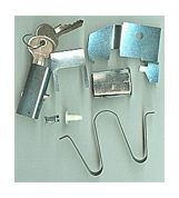 an assortment of keys and hooks on a white surface