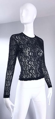 For Sale on 1stDibs - Sexy vintage 90s CALVIN KLEIN black lace cropped top shirt ! Features a fine soft lace that stretches to fit. Tailored body, with sleek long sleeves. Looks Black Lace Tops For Party, Black Lace Party Tops, Black Lace Top With Crew Neck, Elegant Cropped Top With Delicate Lace, Black Lace Crew Neck Top, Fitted Crew Neck Lace Top, Fitted Long Sleeve Lace Top With Delicate Lace, Delicate Lace Cropped Top For Party, Fitted Lace Top With Crew Neck