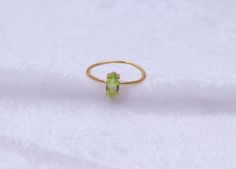 "Materials Gold, Rose gold, White gold Gemstone: Natural Peridot Peridot Ring / 14k Gold Peridot Wedding Ring / Anniversary Ring / Marquise Ring / Stacking Ring / Dainty Ring / Gemstone Ring / Prong set Item Details * Made to Order * Material: 14K Solid Gold (If 18K is needed, please inquire) * Gold Color Choice: Rose Gold, Yellow Gold, White Gold * Total CTW: .50 crt( 4 mm) (varies by size of the ring) * Width of Band: 1.30mm Ready to Ship in 7-10 Business Days * Also available in other gemston Stackable Yellow Gold Peridot Jewelry, Yellow Gold Peridot Stackable Rings For Anniversary, Stackable Peridot Wedding Jewelry, Yellow Gold Stackable Rings With Peridot, Gold Marquise Ring With Birthstone, Wedding Stackable Peridot Rings, Yellow Gold Peridot Stackable Rings For Wedding, Yellow Gold Peridot Ring For May Birthstone, Fine Jewelry Peridot Rings As Gift