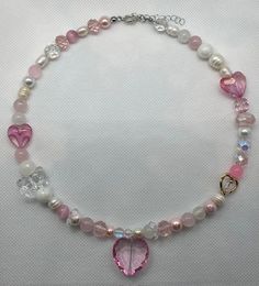 Handmade necklace Materials used: -glass crystal heart -glass beads -glass crystal beads -freshwater pearls Pink Crystal Heart Pendant Necklace, Pink Crystal Necklace With Heart Charm, Pink Round Beads Jewelry For Valentine's Day, Pink Pearl Charm Jewelry For Valentine's Day, Pink Heart Cut Necklaces With Heart Beads, Pink Crystal Jewelry For Mother's Day, Feminine Pink Necklace With Heart Charm, Valentine's Day Pink Jewelry With Pearl Charm, Valentine's Day Pink Pearl Charm Jewelry