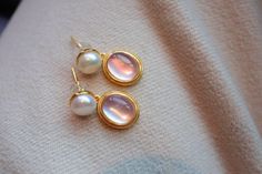 Pink Natural Crystal Mother of Pearls Earrings Gold Vermeil Material: Gold Vermeil on 925 Sterling Silver, Natural Crystal, Mother of Pearls with Freshwater Pearls Note: Our jewelry is handmade. Naturally formed shapes of freshwater baroque pearls may vary. The actual product may be slightly different from the pictures shown. Elegant Cabochon Pearl Drop Earrings, Fine Jewelry Pink Gemstone Earrings, Exquisite Pearl Earrings Gift, Exquisite Pearl Gemstone Earrings As Gift, Exquisite Gemstone Pearl Earrings As Gift, Exquisite Gemstone Pearl Earrings For Gift, Luxury Pink Round Earrings, Feminine Gold Round Pearl Earrings, Elegant Cabochon Drop Earrings