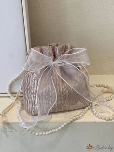 Bird in Bag - Faux Pearl Decorative Design Bucket with Bow Accent Large Capacity Beige Shoulder Bag For Party, Beige Large Capacity Shoulder Bag For Party, Beige Rectangular Bucket Bag For Party, Beige Large Capacity Party Bag, Beige Bucket Shoulder Bag Gift, Beige Bucket Shoulder Bag As Gift, Beige Crossbody Bucket Bag As Gift, Beige Bucket Shoulder Bag For Party, Beige Party Bags For Spring