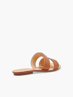 Luxe Vachetta leather slides. With geometric flair. A chic and easy go-to any day of the week. Features 1/3" heel Rubber sole Imported Material: 100% Leather | Hannah Vachetta Leather Slides Talbots Chic Brown Leather Slides, Trendy Brown Leather Slides, Chic Brown Slides With Leather Footbed, Chic Flat Leather Slides, Chic Leather Flat Slides, Modern Brown Slide Mules, Chic Leather Slide Mules, Modern Brown Flat Slides, Narrow Shoes