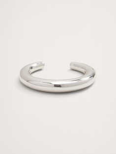 Our wide-profile curving cuff is made of hollow cast brass and hand-polished to a gleaming shine.  Curved ends make for easy wearability.  Gold-finished or silver-plated brass.  Made in India.  Diameter: 3. 2" Inner diameter: 2. 3" Opening 1. 3" Summer Style, Banana Republic, Women's Accessories, Silver Plated, Summer Fashion, It Cast, Cuff, Women Jewelry, Brass