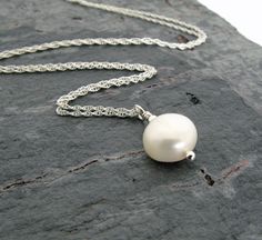 "Love this simple white pearl necklace! The pearl has a beautiful creamy white color, great luster, and the shape is very nice. It faces up round, and from the side it is more flat on the back and domed on top, giving it a low profile. Due to the nature of natural gemstones each pearl is unique and has it's own subtle characteristics. The pearl shown is an example, your pearl will be very similar. Also shown are optional matching pearl and sterling silver earrings - together they make a very pre Simple Pearl Necklace, Beautiful Pearl Necklace, Pearl Gifts, Simple Pearl, Filigree Necklaces, Montana Wedding, Minimalist White, White Pearl Necklace, Tourmaline Necklace