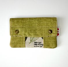 The wallet/purse is a perfect complement for your money, coins and cards that you carry every day. It has a zipper closure, allowing you to put your money and cards neatly. In addition, it has two snap buttons that give you more security. Its design is modern, timeless and functional. The colors are warm, beautiful and combinable. MEASURES: Height - 10 cm approx. Width - 15 cm approx. MATERIALS: Exterior - Durable upholstery fabric. metal snaps Interior - Printed cotton fabric. TAKE CARE OF YOUR Green Wallets With Interior Card Slots, Everyday Green Wallets With Interior Card Slots, Green Rectangular Pouch With Zipper Pocket, Rectangular Green Pouch With Zipper Pocket, Green Travel Card Holder With Interior Slots, Green Rectangular Bag With Coin Pocket, Green Wallets With Card Slots For Daily Use, Green Rectangular Wallet With Zipper Pouch, Everyday Green Coin Purse With Card Slots