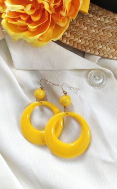 Yellow hoop vintage earrings , vintage jewellery , 40 s, 50 s style earrings , pin up jewellery, roockabilly earrings , yellow hoop earrings,  This fabulous jewellery are handmade by me, in the style of a 1940 ' s 50 's novelty bakelite brooch design. This eye catching earrings will finish off your perfect wardrobe and look amazing !   Perfect for every  styling.   Earrings measures  7  cm length and 4.5 cm across. All my things  are done with care for every detail. If you have a question don 't hesitate to ask! The colour may vary depending on the monitor settings Retro Jewelry For Gifts, Retro Jewelry Gift, Party Yellow Pierced Jewelry, Retro Dangle Jewelry For Party, Retro Round Earrings For Party, Vintage Summer Hoop Earrings, Retro Yellow Dangle Earrings, Retro Yellow Dangle Jewelry, Retro Jewelry For Parties