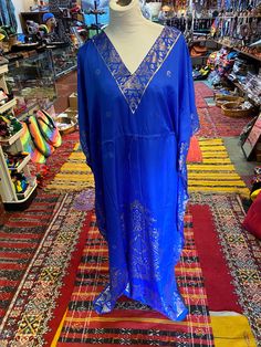 Stylish and comfortable, our Moroccan caftans are pleasing to the eye as well to the touch. This green caftan is handmade in Morocco with delicate gold embroideries around the edges and the chest. It gives you a Moroccan charm with a whole lot of elegance. This versatile Butterfly style caftan comes in One size suits medium to X-large.  Approximately 56 inches around chest and around the hips, 55 to 56 inches long Handmade from viscose and cotton , You could wear this caftan in a resort holidays African Kaftan, Men Kaftan, Cruise Dress, Beach Kaftan, Moroccan Kaftan, Butterfly Style, Moroccan Caftan, Ethnic Design, Lounge Dress